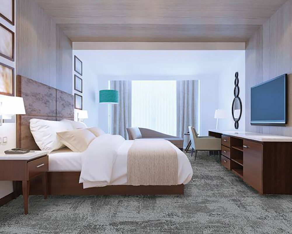 Hotel bedroom with broadloom carpet